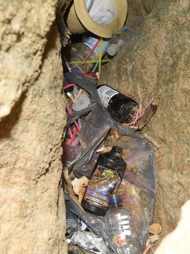 Rubbish rests down a hole in the cliffs. Picture: Jason Sammon