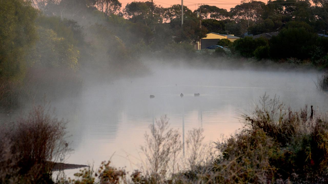 Mist rises from the Munno Para wetlands on Monday morning. Picture: Photo Sam Wundke