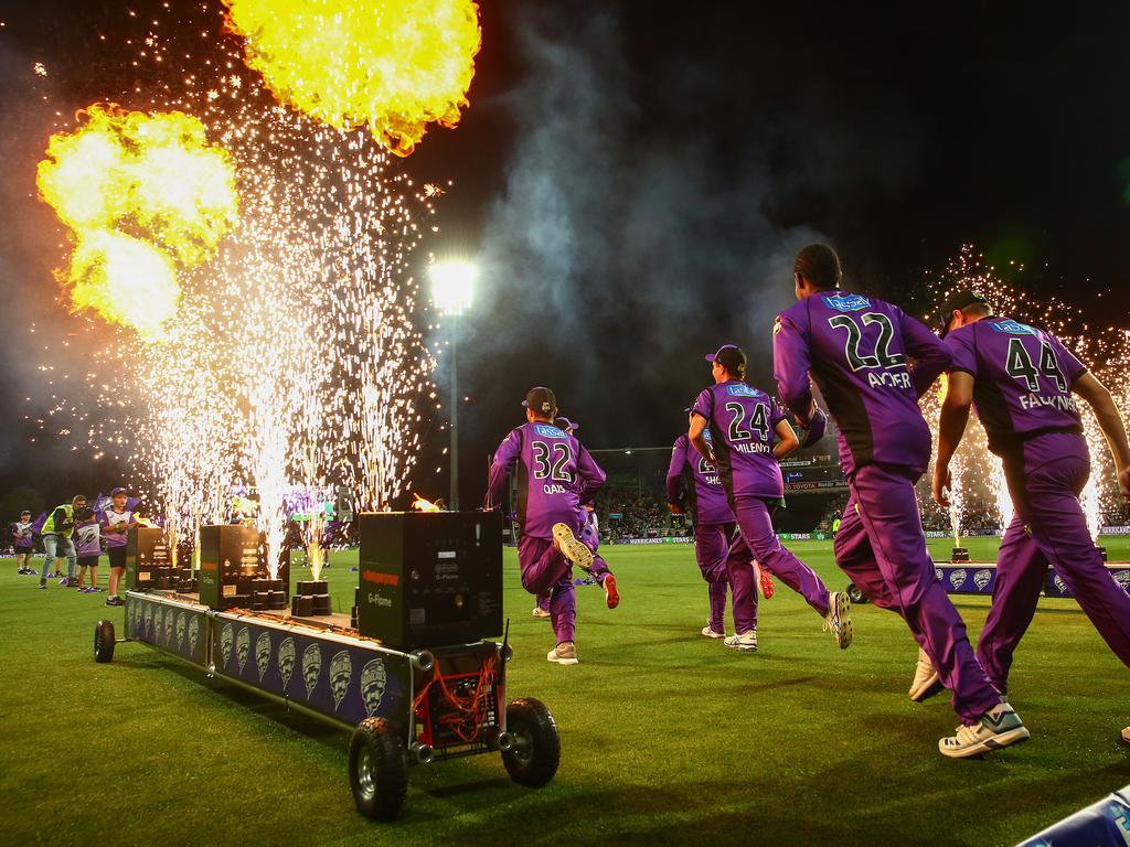 The Hurricanes run through flames onto the field during the Big Bash League last season