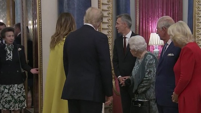 The Queen appears to gesture towards Princess Anne after the chat with Donald Trump. Picture: Supplied