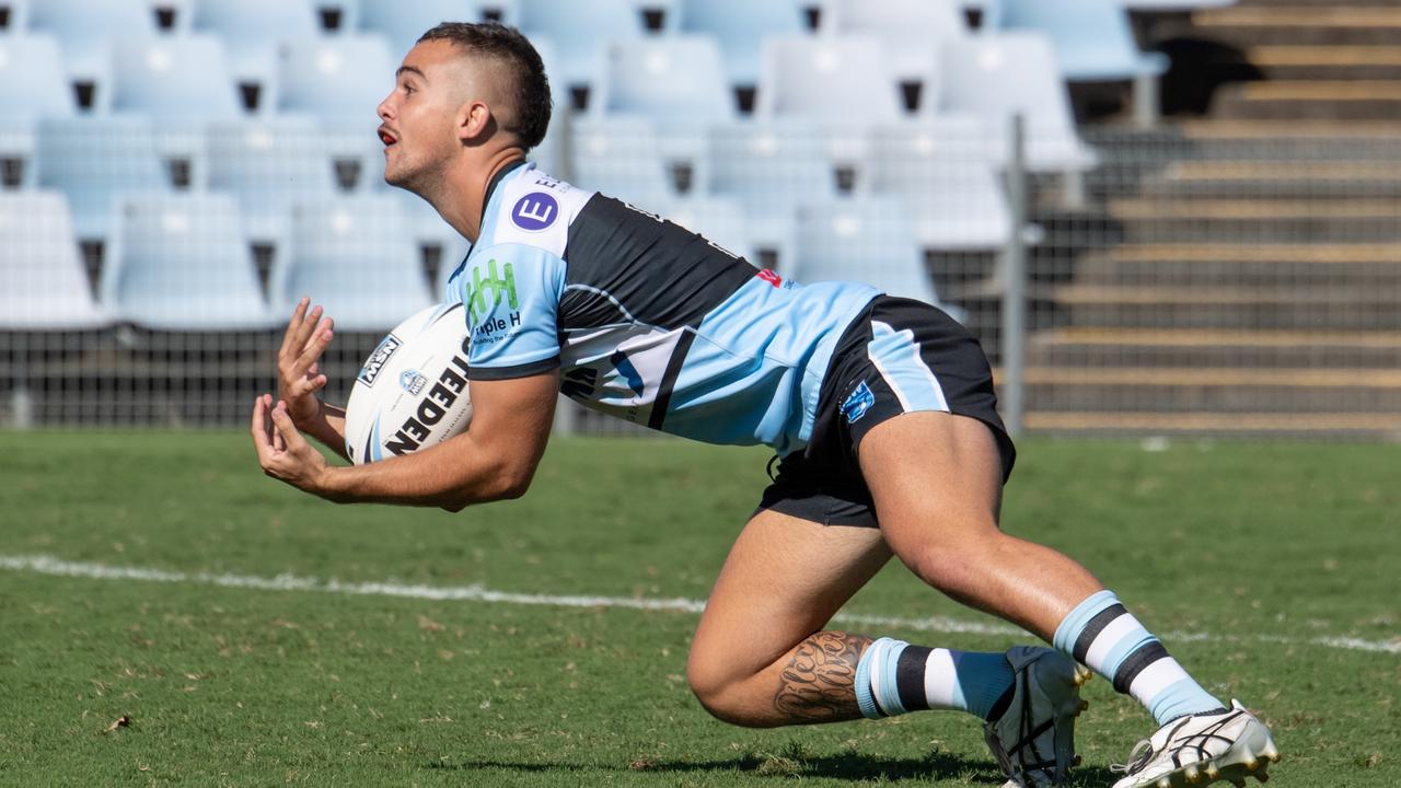 A Cronulla player seals the ball. Picture: Monique Harmer