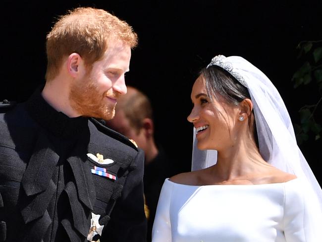 (FILE PHOTO) Prince Harry, Duke of Sussex and Meghan, Duchess Of Sussex have announced they are to step back as Senior Royals and say they want to divide their time between the UK and North America. WINDSOR, UNITED KINGDOM - MAY 19: Britain's Prince Harry, Duke of Sussex and his wife Meghan, Duchess of Sussex leave from the West Door of St George's Chapel, Windsor Castle, in Windsor on May 19, 2018 in Windsor, England. (Photo by  Ben STANSALL - WPA Pool/Getty Images)