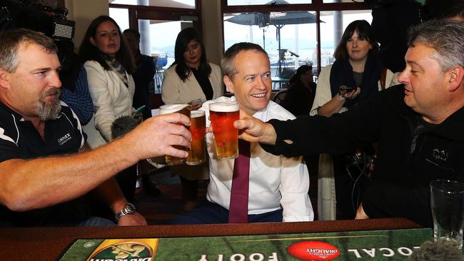 Labor leader Bill Shorten has a beer with Beaconsfield Mine disaster survivors Todd Russell and Brant Webb at the Beauty Point Waterfront Hotel. Picture: Chris Kidd