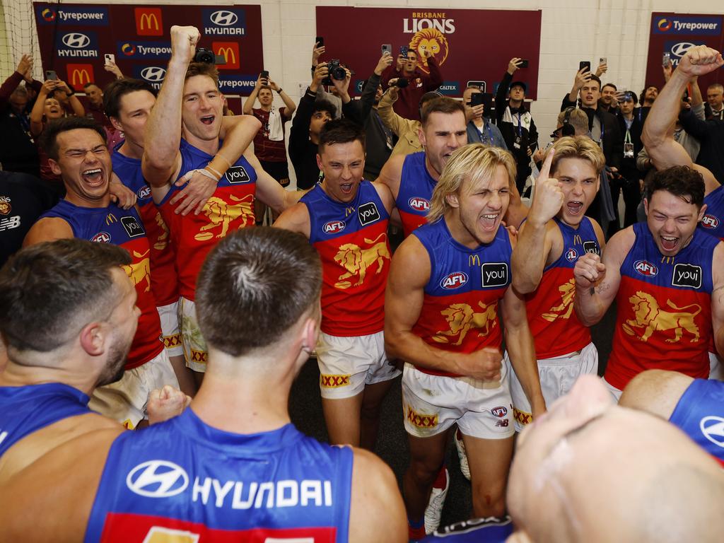 Kai Lohmann and his teammates enjoy the win after singing the song. Picture: Michael Klein