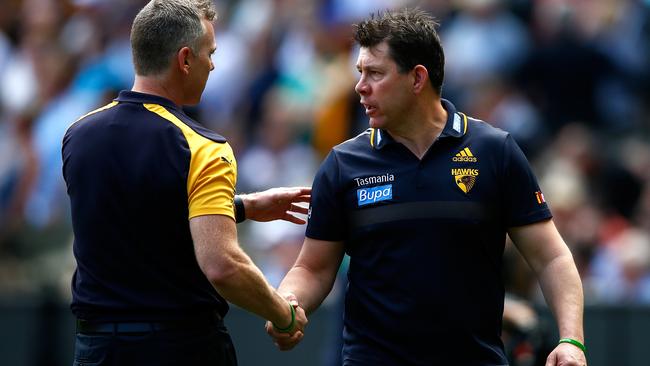 Brett Ratten shakes hands with Adam Simpson. Picture: Wayne Ludbey