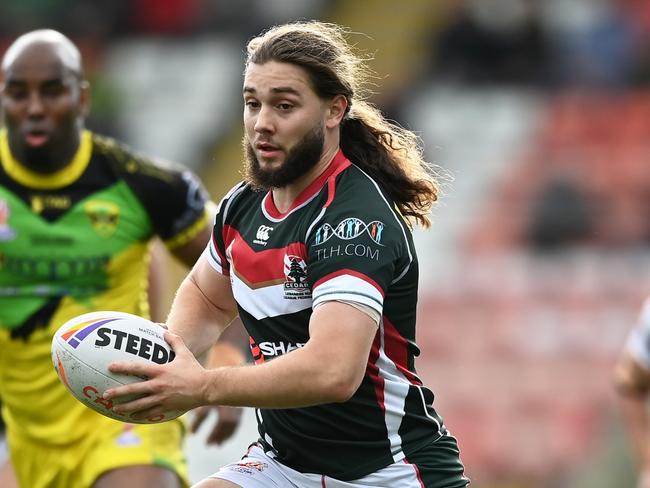 LEIGH, ENGLAND - OCTOBER 30: Khaled Rajab of Lebanon breaks with the ball during Rugby League World Cup 2021 Pool C match between Lebanon and Jamaica at Leigh Sports Village on October 30, 2022 in Leigh, England. (Photo by Gareth Copley/Getty Images)