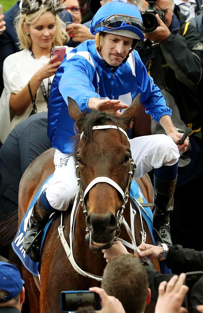 Hugh Bowman and Winx after their history-making day. Picture: Colleen Petch