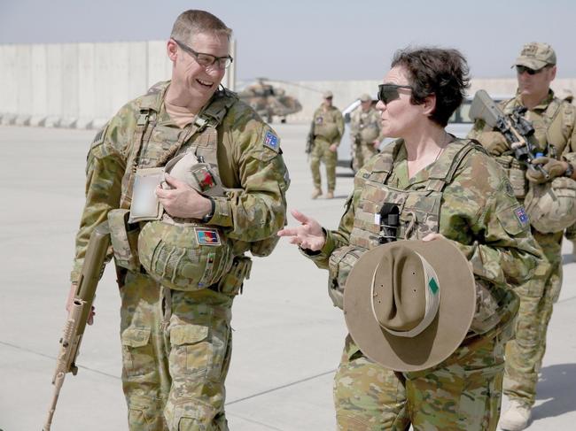 Australian Army Officer and Deputy Commander headquarters Joint Task Force 633 Brigadier Kathryn Campbell (right) is given a tour of the Afghan Airforce flight line by Director of the Australian component of the Train Advise Assist Command – Air, Royal Australian Air Force Officer Group Captain Terry Deeth at Kabul air base in Afghanistan.