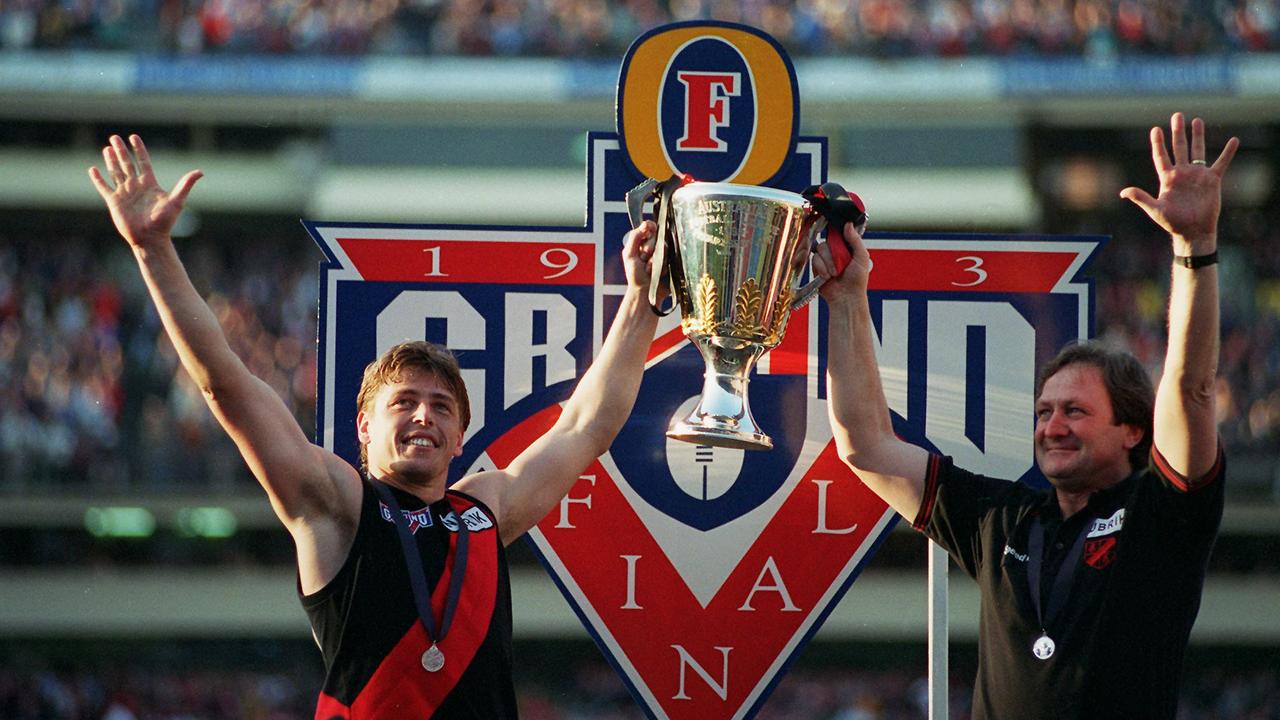 Captain Mark Thompson and coach Kevin Sheedy hold up the Premiership Cup. 1993 Grand Final. Essendon v Carlton. MCG.