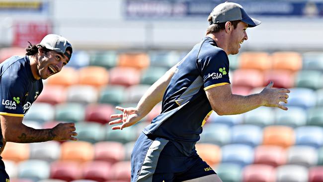 Johnathan Thurston and Michael Morgan. Picture: Zak Simmonds