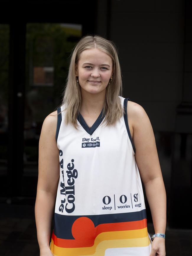 18-year-old Ruby Dunbar models her cohort’s Schoolies top. Picture: Brett Hartwig