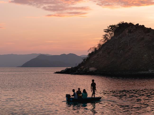 EMBARGO FOR TWAM, 15 FEBRUARY 2025. FEE MAY APPLY. Guests on the beach, Komodo Islands, Seven day Spice Islands and Coral Triangle cruise with Aqua Expeditions (Aqua Blu Yacht). Photo: Supplied