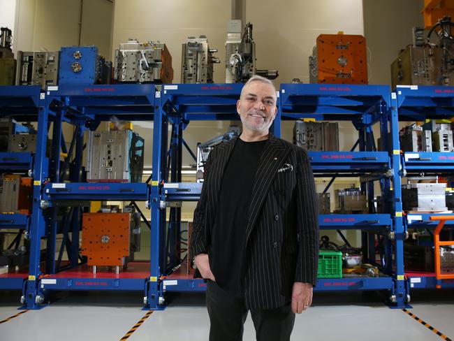 01/06/2023. Peter Freedman, owner of Rode, which has been a big success story exporting Rode microphones around the world, pictured at the company's manufacturing facility in Silverwater in Sydney's Western suburbs with view to high-tech robotic plastic injection mould operations in background. Britta Campion / The Australian
