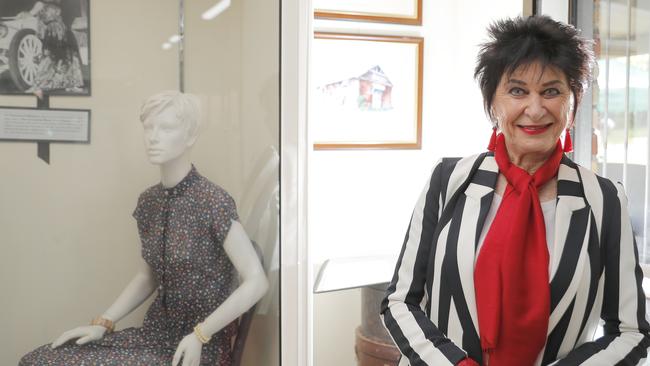 Laurene Hassard, daughter of Gold Coast fashion and aviator trailblazer Ivy Hassard, in front of her mother’s exhibit. Photo: Regi Varghese