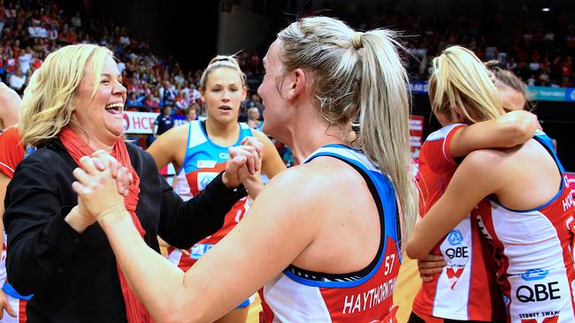 Coach Briony Akle (left) from the NSW Swifts celebrates with her players after winning the Super Netball preliminary final. The Swifts would win the grand final a week later. Picture: AAP/David Gray