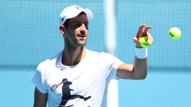 Novak Djokovic was injured during his practice match against Daniil Medvedev in Melbourne. Picture: Graham Denholm/Getty Images