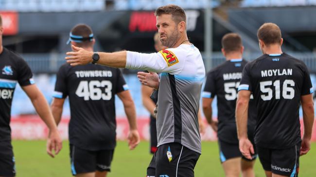 Cronulla caretaker coach Josh Hannay will stay on at the Sharks as an assistant next season.