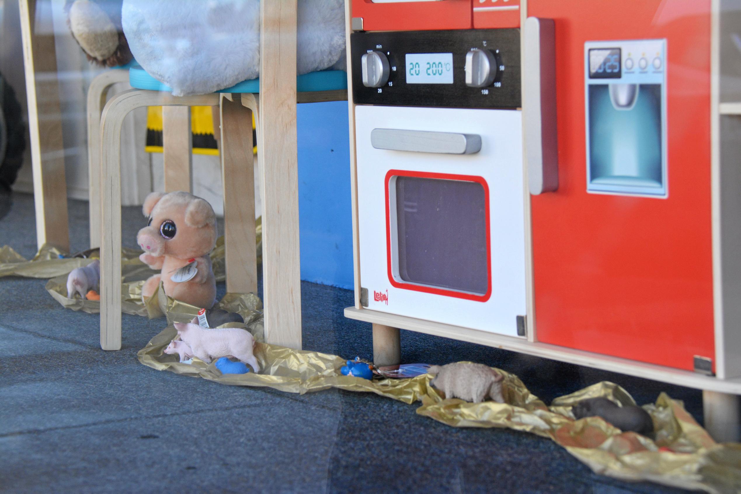 A line of little piggies inspect the toys on show at Kingaroy Toyworld as part of the BaconFest Street Window competition. Picture: Jessica McGrath