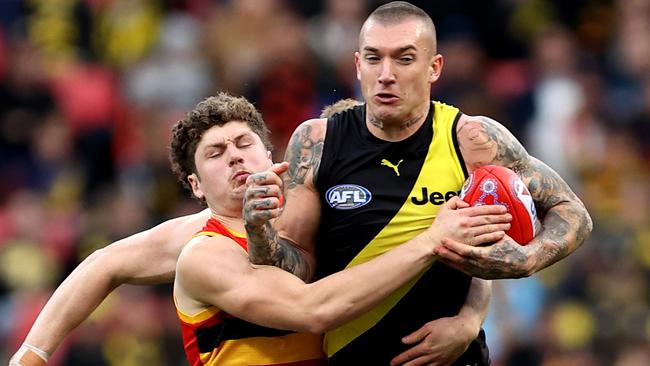 Dustin Martin tries to break clear.