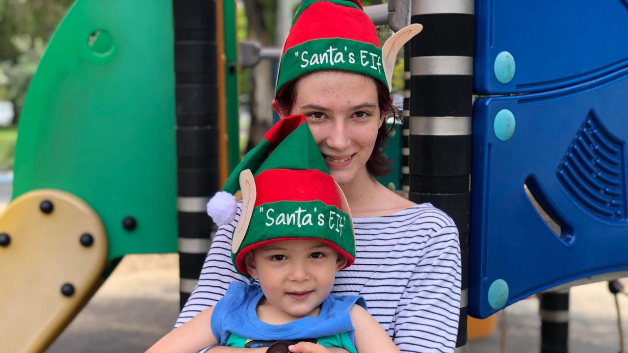 Daniella Doyle and Dominic Boyle enjoy Christmas celebrations at Cotton Tree Park. Picture: Laura Pettigrew.
