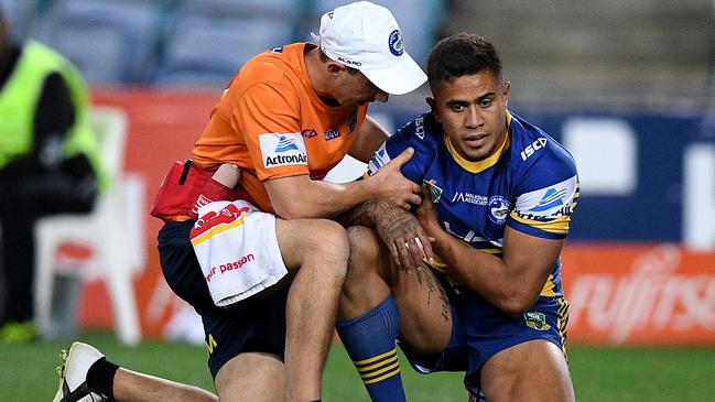 Kaysa Pritchard of the Eels is assisted from the field after sustaining a suspected dislocated shoulder during the Round 20 NRL match between the South Sydney Rabbitohs and the Parramatta Eels at ANZ Stadium in Sydney, Saturday, July 28, 2018. (AAP Image/Dan Himbrechts) NO ARCHIVING, EDITORIAL USE ONLY