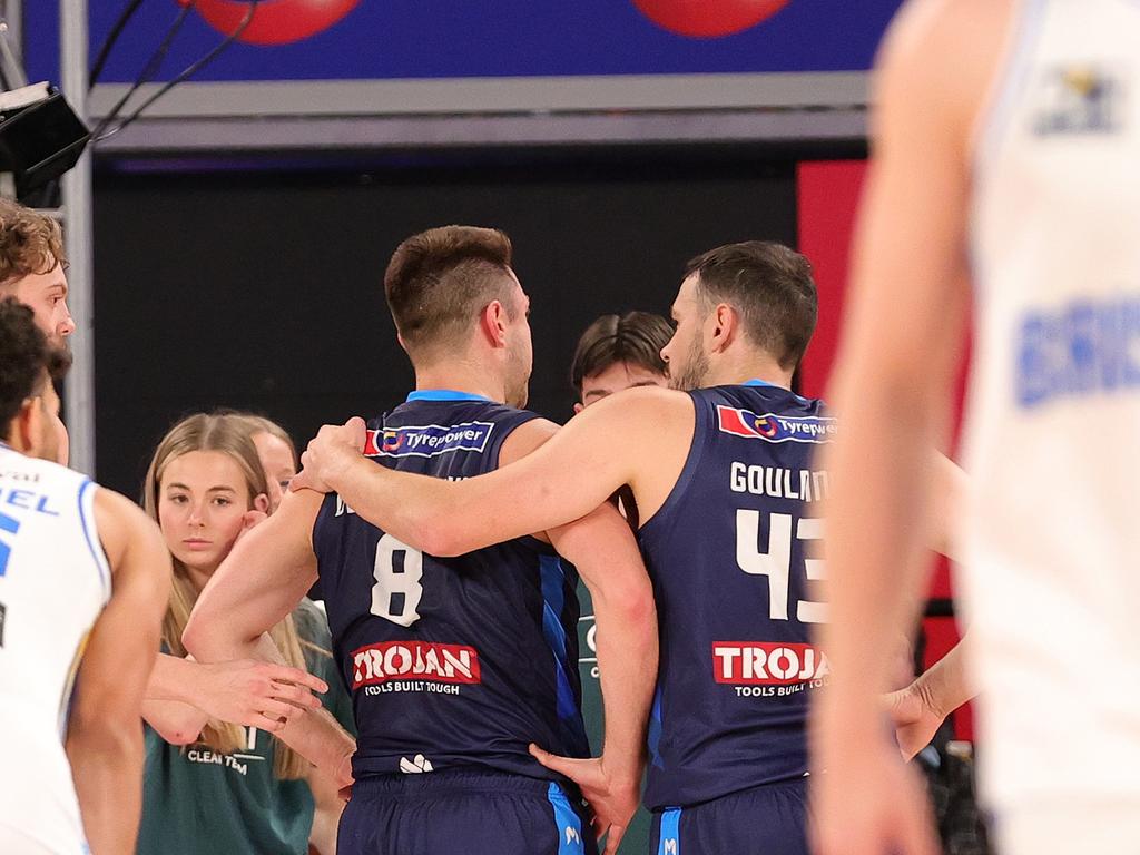 Matthew Dellavedova of United is assisted by Chris Goulding of United after a collision during the round three NBL match between Melbourne United and Brisbane Bullets at John Cain Arena. Photo: Kelly Defina/Getty Images.