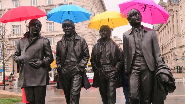 Even The Beatles are prepared for the weather in Liverpool.