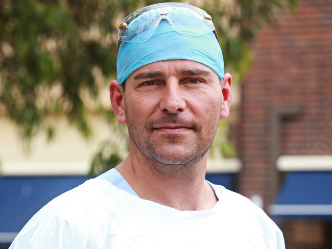 Manly Hospital theatre nurse Olivier Debarge protesting out the front of Manly Hospital. Picture: Adam Yip.