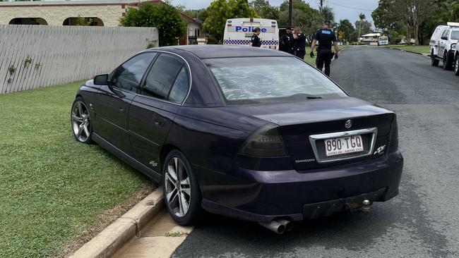 A black Holden commodore has mounted the curb in Andergrove after police instructed the driver to pull over. Photo: Fergus Gregg