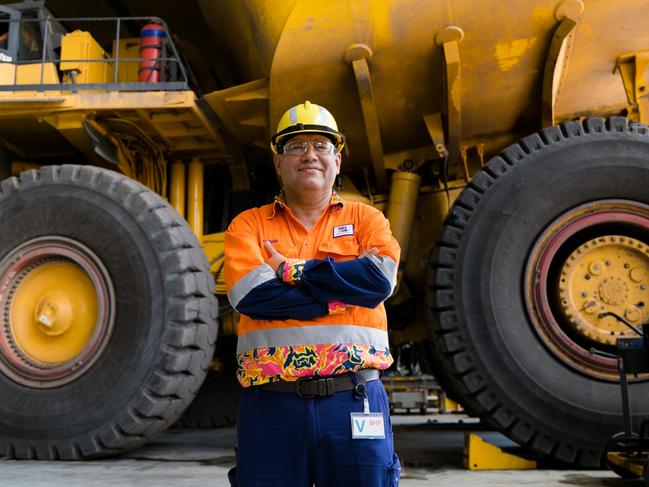 BHP Minerals Australia President Edgar Basto in front of a Komatsu haul truck at Goonyella Riverside Mine