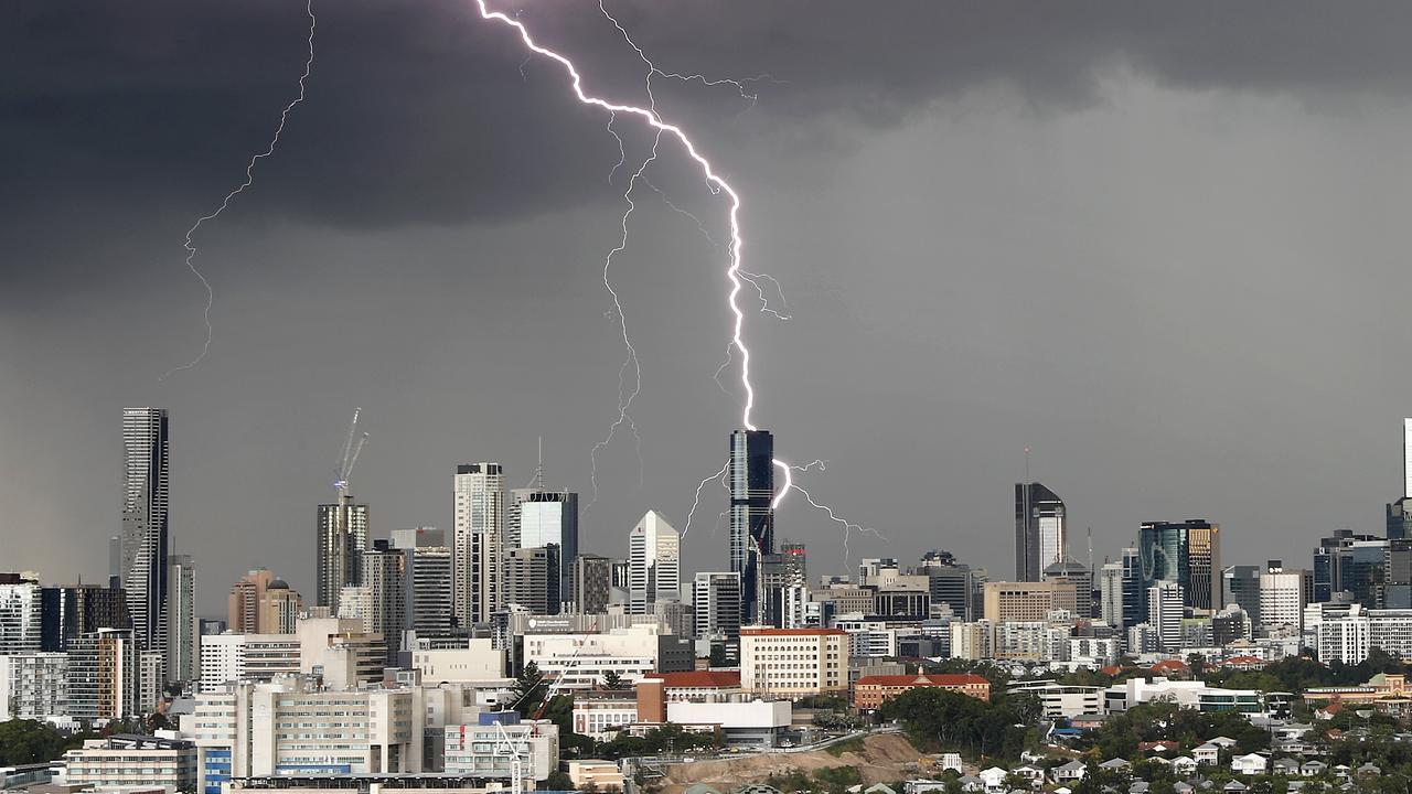 A storm pictured passing over Brisbane CBD on Thursday morning, as seen from north of the CBD. Picture: Josh Woning)