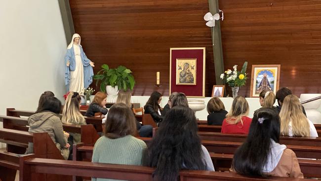 A Gold Coast Brazilian group held prayers at Calvary Catholic Church for Brazilian national Ivan Susin. (Photo/Steve Holland)