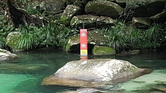 Queensland Parks and Wildlife services have installed warning signs at Josephine Falls which indicate to swimmers when it is safe to swim, when to exercise caution and when to stay out of the water at the popular swimming hole. The installation of the warning signs came one month after a coronial inquest into two deaths at the waterfall recommended a warning system be installed. PICTURE: BRENDAN RADKE