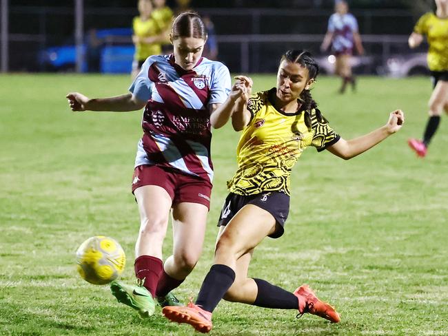 Strikers' Cassie Ross attempts to stop Tigers' Chantelle Ahloy taking a shot at goal in the Football Queensland Premier League (FQPL) Far North and Gulf women's grand final match between the Edge Hill Tigers and the Redlynch Strikers, held at Endeavour Park, Manunda. Picture: Brendan Radke