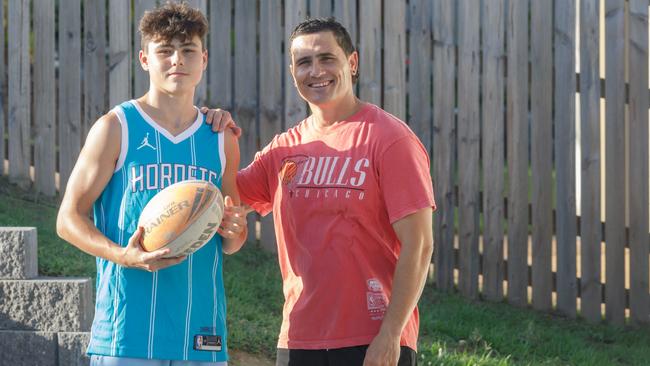 PJ Marsh with eldest son Braelan, who has signed with the Dolphins, at home in Yeppoon. Picture: Steve Vit