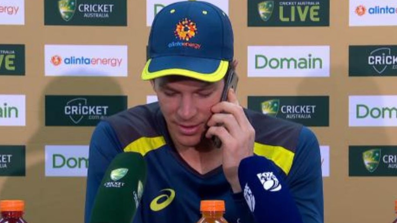 Tim Paine answers the journalist's phone.