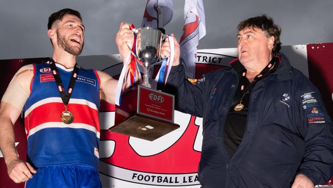 Keilor captain Kane Barbuto and coach Mick McGuane hoist the silverware in 2019. Picture: Jamie Morey