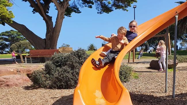 Flynn and Natalija on the slide at Mornington Park.