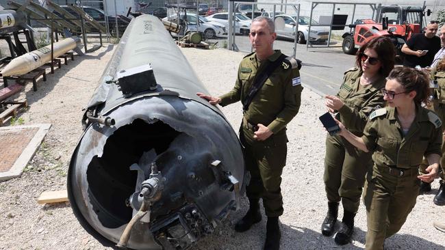 Members of the Israeli military show an Iranian ballistic missile which fell in Israel on the weekend. Picture: Gil Cogen-Magen/AFP