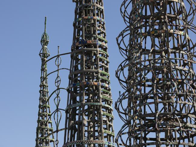 Watts, California, USA - February 25, 2023: Afternoon sun shines on artist Simon Rodia's Watts Towers, a fine example of Art Brut.