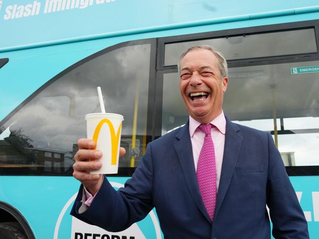 Reform UK party leader Nigel Farage holds a milkshake during his election candidacy in June.