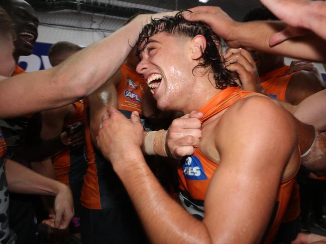 Jones was embraced by his teammates and received a standing ovation from the Canberra crowd late in the game. Picture: Mark Metcalfe/AFL Photos/via Getty Images