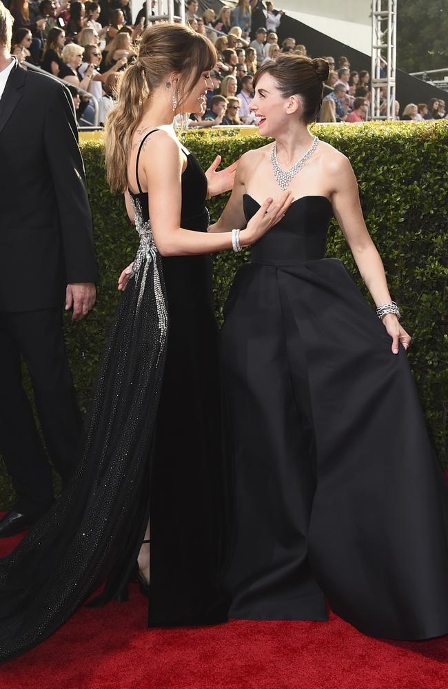 Dakota Johnson and Alison Brie attend The 75th Annual Golden Globe Awards at The Beverly Hilton Hotel on January 7, 2018 in Beverly Hills, California. Picture: AP