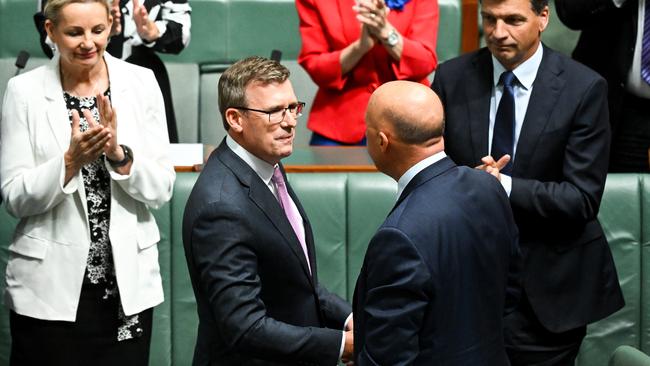 Peter Dutton congratulates Alan Tudge after the former education minister’s post-question time farewell speech to parliament on Thursday. Picture: AAP