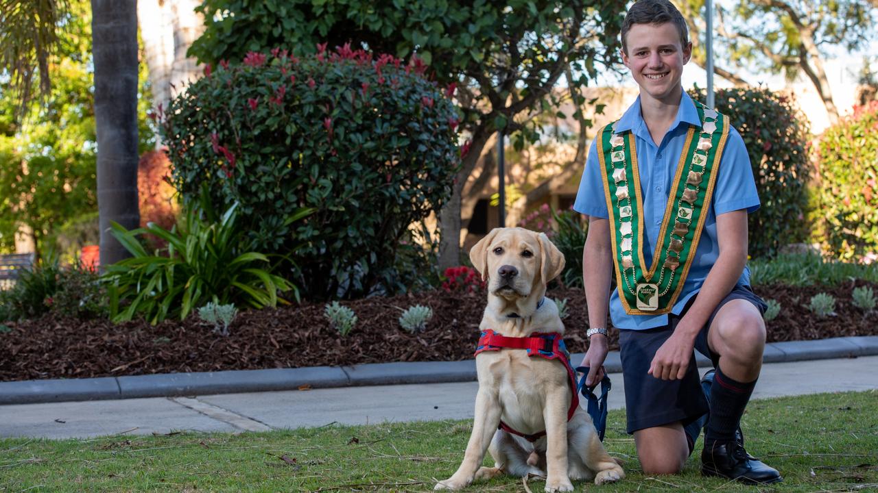 Lockyer Valley young citizen of the year and Toowoomba State High School student Cameron Maizey with prison pup in training Tommy. PHOTO: Ali Kuchel