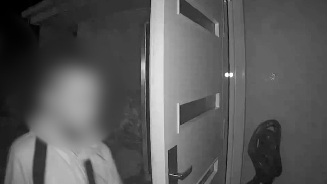 One of the intruders enters the Geary home at Dudley. Pictures: Supplied