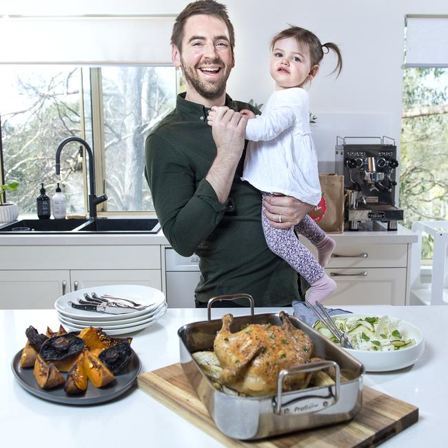 Chef Callum Hann with his daughter Elle Hann 22 months serving Roast Chicken with Fennell and Thyme ,Shaved Zucchini Salad and Balsamic Roasted Pumpkin and Mushrooms for a fathers day meal.Tuedsday, August,24,2021.Picture Mark Brake