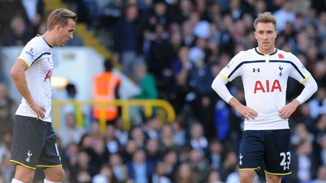 Tottenham Hotspur's English striker Harry Kane (L) and Danish midfielder Christian Eriksen (R) react at the restart after Stoke City scored their second goal during the English Premier League football match between Tottenham Hotspur and Stoke City at White Hart Lane in north London on November 9, 2014. AFP PHOTO / OLLY GREENWOOD RESTRICTED TO EDITORIAL USE. No use with unauthorized audio, video, data, fixture lists, club/league logos or “live” services. Online in-match use limited to 45 images, no video emulation. No use in betting, games or single club/league/player publications