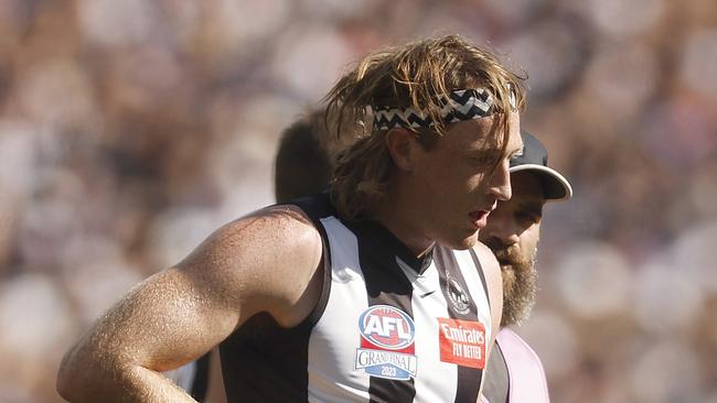 MELBOURNE, AUSTRALIA - SEPTEMBER 30: Nathan Murphy of the Magpies leaves the field with trainers during the 2023 AFL Grand Final match between Collingwood Magpies and Brisbane Lions at Melbourne Cricket Ground, on September 30, 2023, in Melbourne, Australia. (Photo by Daniel Pockett/AFL Photos/via Getty Images)