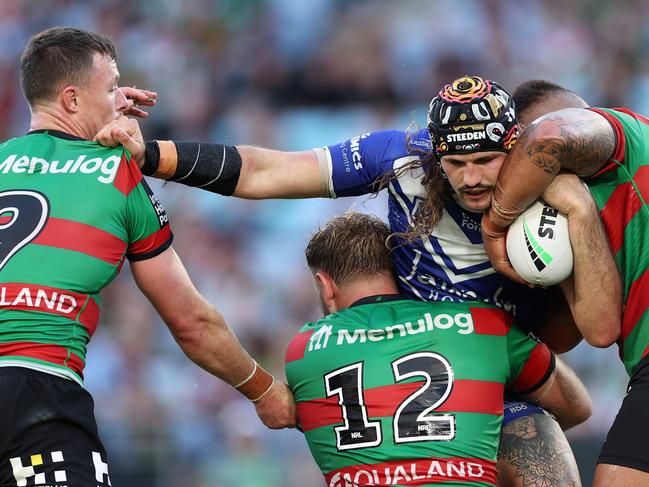 SYDNEY, AUSTRALIA - MARCH 29: Josh Curran of the Bulldogs is tackled during the round four NRL match between South Sydney Rabbitohs and Canterbury Bulldogs at Accor Stadium, on March 29, 2024, in Sydney, Australia. (Photo by Cameron Spencer/Getty Images)